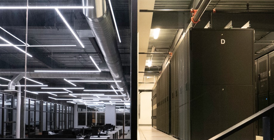 Interior of an Office with desks split with Colocation Cabinets