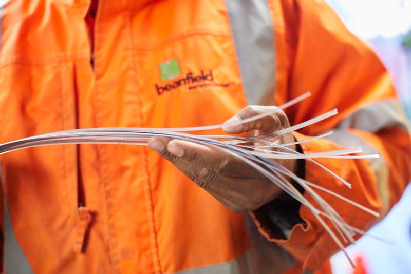 man holding fibre cables